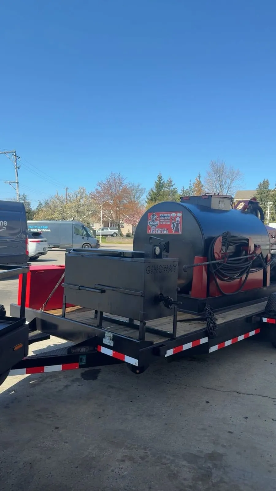 Knockout's trailer-mounted sealcoating tank and applicator